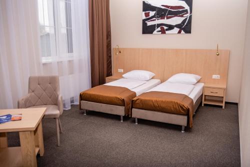 Кровать или кровати в номере Отель РиверСайд