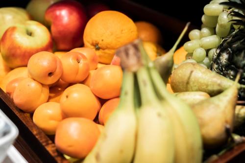 a bunch of fruits and vegetables in boxes at HARBR Hotel Ludwigsburg, a member of Radisson Individuals in Ludwigsburg