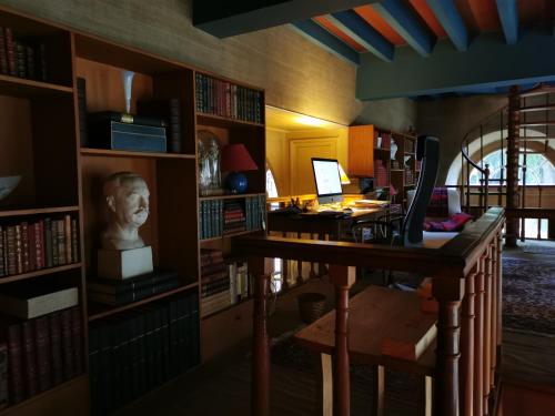 a library with a desk and a bust of a head at Château de Chasseneuil sur Bonnieure in Chasseneuil-sur-Bonnieure
