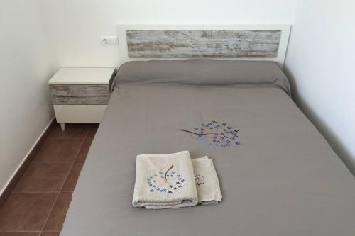 A bed or beds in a room at Villa Blanca Punta Grossa