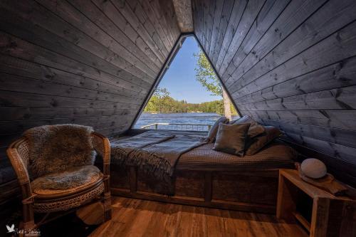 a bedroom with a bed and a window in a room at Laawu Kultaa in Kotka
