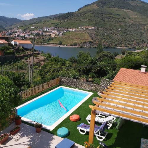 a swimming pool with a view of a mountain at Casa da Padaria in Folgosa