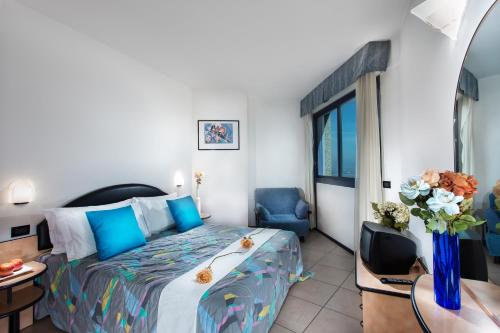Postel nebo postele na pokoji v ubytování Lido Hotel Residence