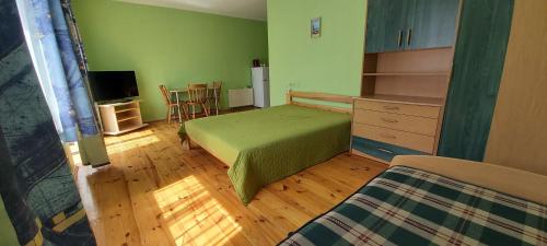 Ένα ή περισσότερα κρεβάτια σε δωμάτιο στο Kastycio 6a