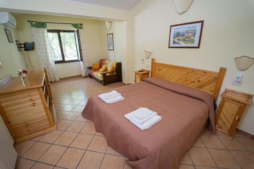 Ένα ή περισσότερα κρεβάτια σε δωμάτιο στο Agriturismo Zugarelli