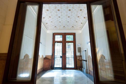 a hallway with glass doors and a ceiling at BacHome Terrace B&B in Barcelona