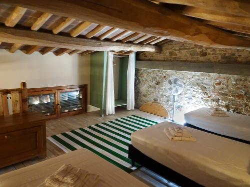 Ένα ή περισσότερα κρεβάτια σε δωμάτιο στο Agriturismo Anna-Rosa