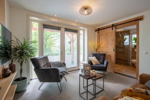 TV a/nebo společenská místnost v ubytování Bed & Breakfast De Heughte
