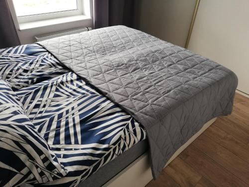 Posteľ alebo postele v izbe v ubytovaní Apartament Szmaragdowy