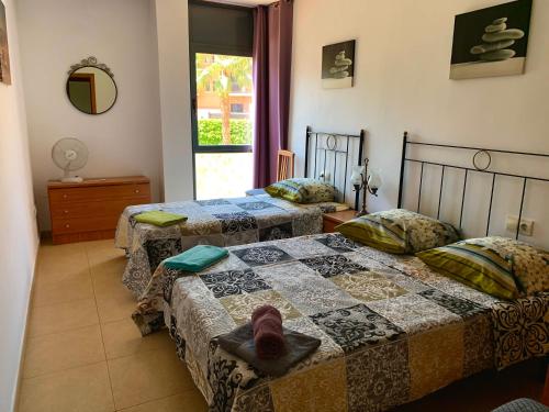 En eller flere senge i et værelse på Apartment Santa Cristina