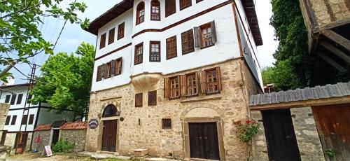 an old house with wooden windows and doors at Paphlagonia Yoruk Muratoglu Konak in Safranbolu