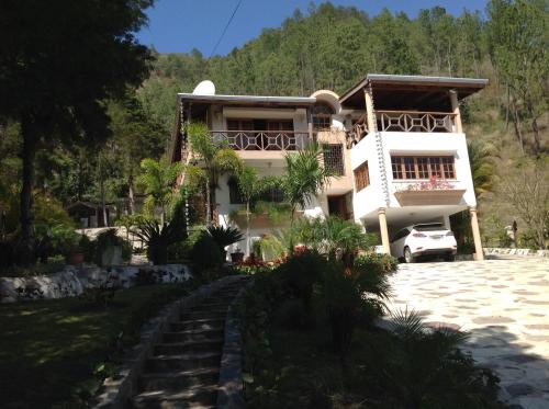 a house with a car parked in front of it at Villa Paloma/ Home/ Office-Remote Office in Constanza