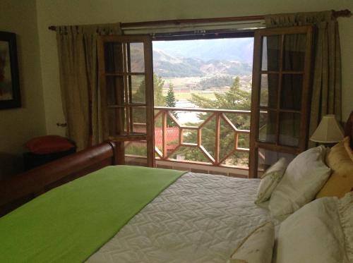 a bedroom with a bed and a window with a view at Villa Paloma/ Home/ Office-Remote Office in Constanza