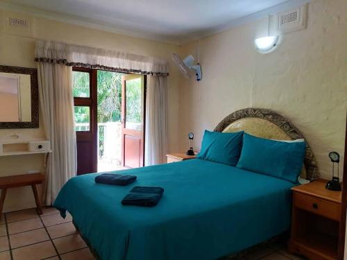 Ένα ή περισσότερα κρεβάτια σε δωμάτιο στο BillsBest Rock Inn
