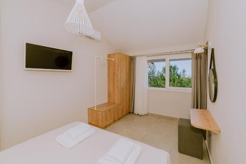 TV a/nebo společenská místnost v ubytování Alion apartments