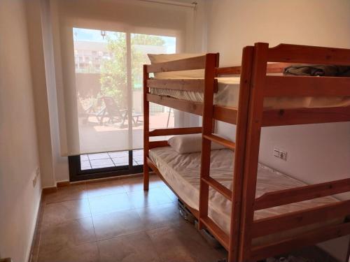 Krevet ili kreveti na kat u jedinici u objektu Panorámica Golfmar c/ Generalitat