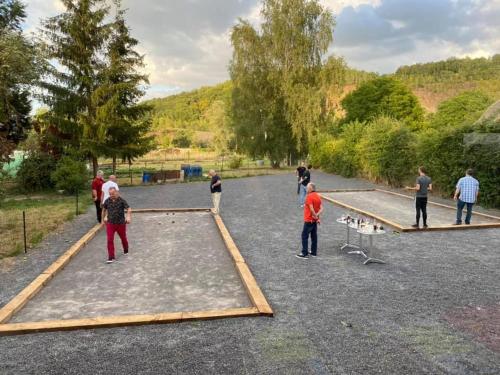 a group of people playing a game on an obstacle course at HOTEL L'AMERIVIERE*** in Aubrives