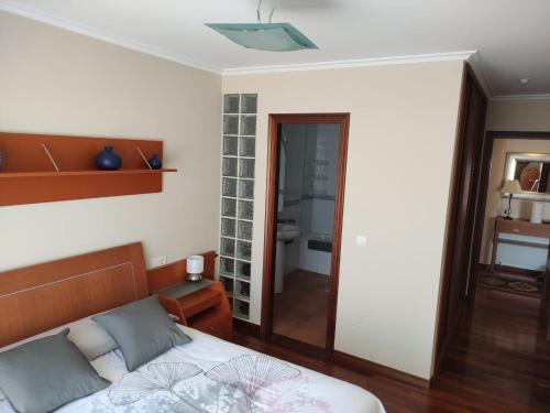 Postel nebo postele na pokoji v ubytování Apartamentos Puerto O Grove