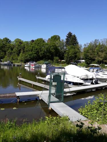 a dock with boats docked in a marina at Ferienwohnung Saarblick in Ockfen