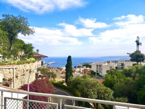 a view of a city from a balcony at Villa Giannina B&B in Taormina