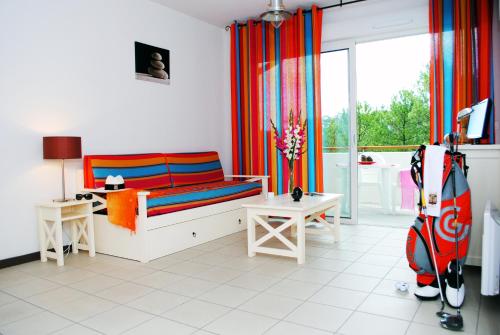 En eller flere senge i et værelse på Résidence Goélia Les Terrasses de l'Océan