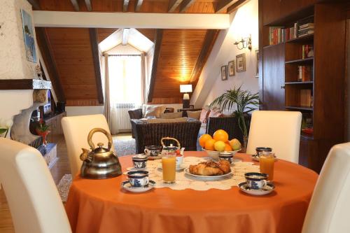 a table with a tea kettle and food on it at Apartment Klecak in Dubrovnik