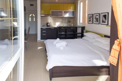 Alessandra Apartmentsにあるベッド