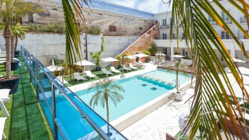 an image of a pool at a hotel at Alentejo Marmòris Hotel & Spa in Vila Viçosa
