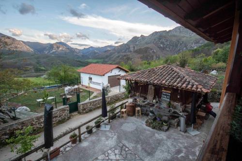 an aerial view of a building with mountains in the background at Casa Les Pedroses in Campiellos