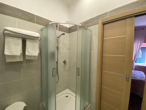 a bathroom with a shower stall and a toilet at Villa Scotillo Boutique Hotel in Agropoli