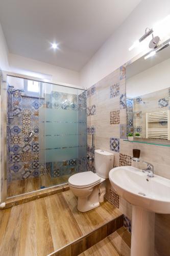 a bathroom with a toilet and a sink and a shower at Sicily in Love - Rooms & Breakfast in Taormina