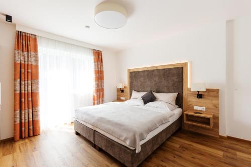 Postel nebo postele na pokoji v ubytování da Peatala Apartments
