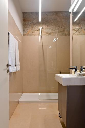 a bathroom with a shower and a sink at Oporto Chic&Cozy - Ribeira in Porto