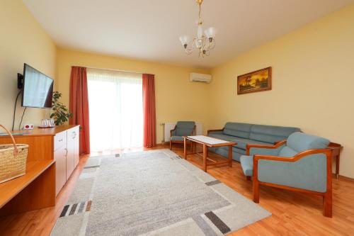 a living room with a couch and a table at Balazs Villa in Balatonfüred