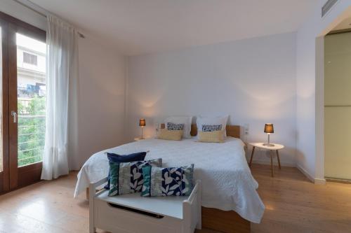 En eller flere senge i et værelse på NEW! Villa Boutique Mallorca