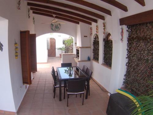 a dining room with a table and chairs at Casa Calida in Murcia