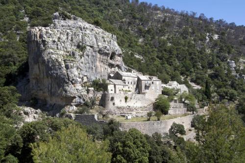 a castle on the side of a mountain at Bungalows Ivan (3757) in Bol