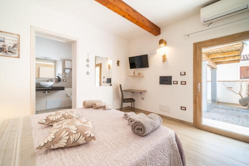 Postel nebo postele na pokoji v ubytování B&B Gonare