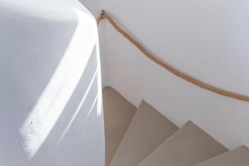 a close up of a wall with a rope at Carpe Diem Villas Mykonos ,Heated Pool! in Ornos