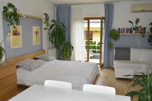 Кровать или кровати в номере STM3 Apartman