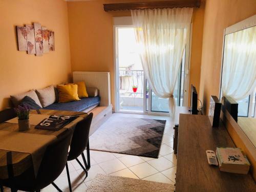 Posezení v ubytování Mina Apartments Nea Kallikrateia