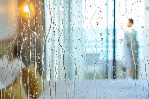 a close up of a window with rain drops on it at Les Roches Brunes in Collioure