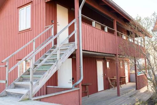 a staircase on the side of a red building at Prästgårdens Pensionat in Mollösund