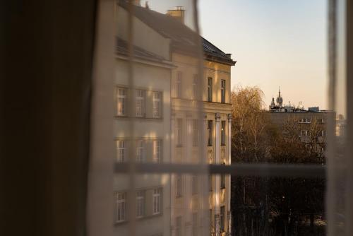 a view of a building from a window at Starowislna 77 in Kraków