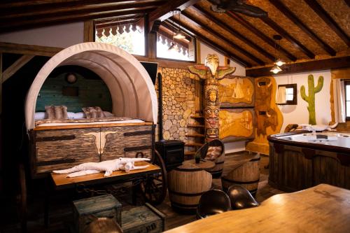 a room with a room with a bed and a table at Posada la Leyenda in Santillana del Mar