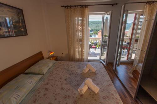 Postel nebo postele na pokoji v ubytování Apartman Budimir1