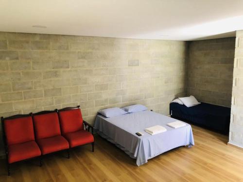 A bed or beds in a room at Recanto Praia Grande