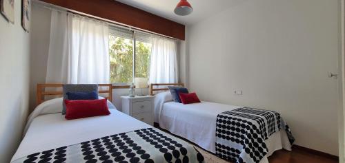 Un pat sau paturi într-o cameră la Vista Azul