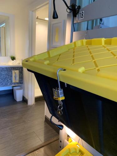 a yellow counter with a sink in a room at Bposhtels Las Vegas in Las Vegas