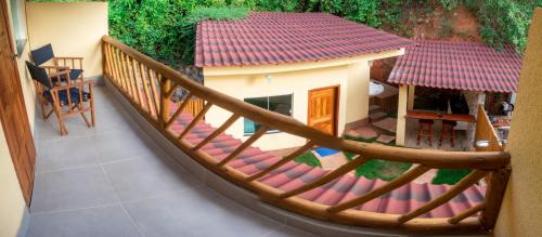 a model of a small house on a balcony at Chalé Ribeirão do Meio in Lençóis